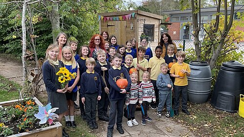 Cllr Karen Holmes meeting NMPS Children in their Wellbeing Garden and Allotment